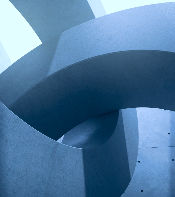 Curved architectural concrete structures overlapping in an abstract design