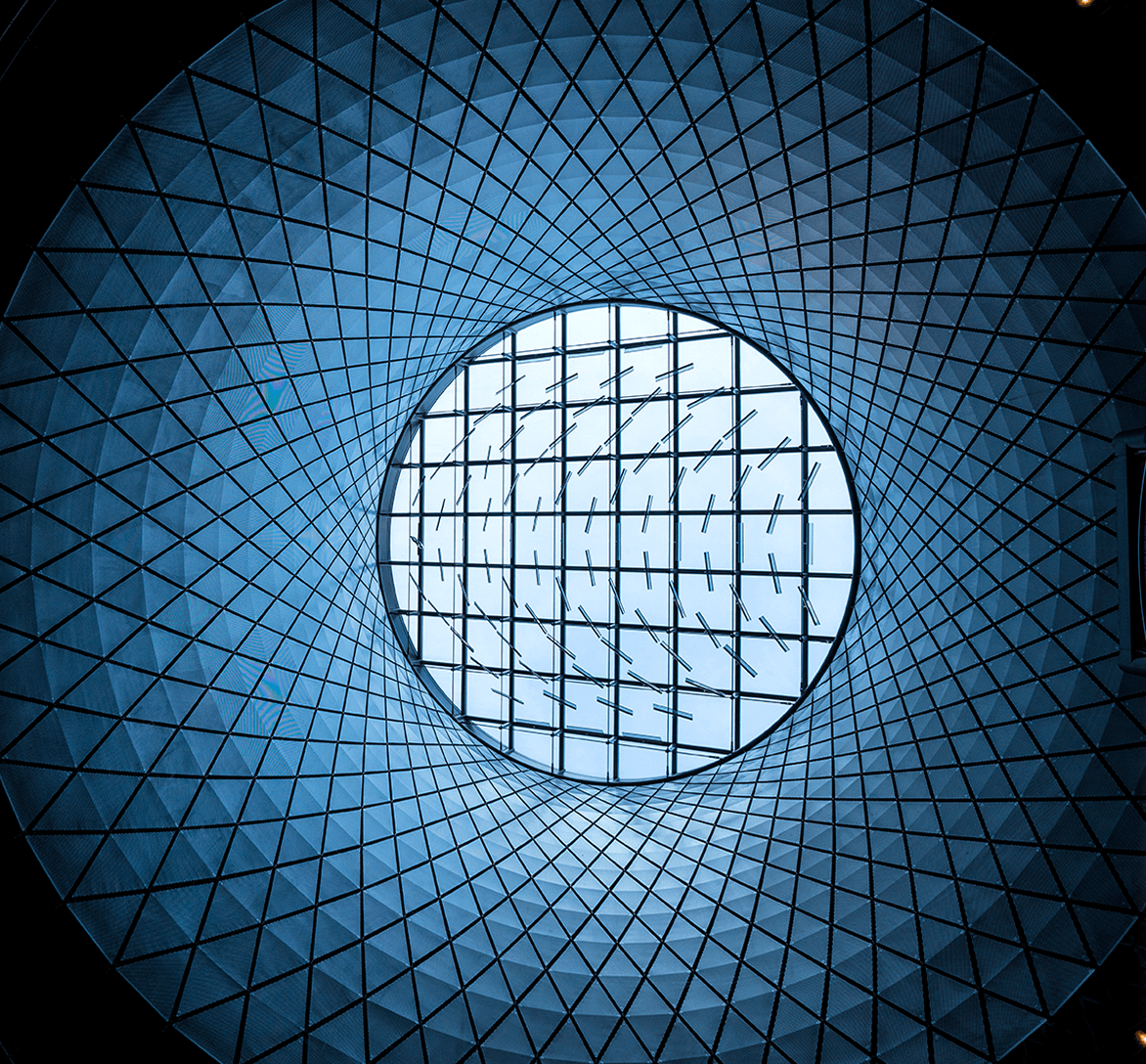Circular glass ceiling with a geometric grid pattern