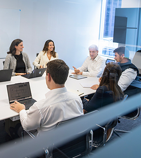 Team members having a discussion in a conference room